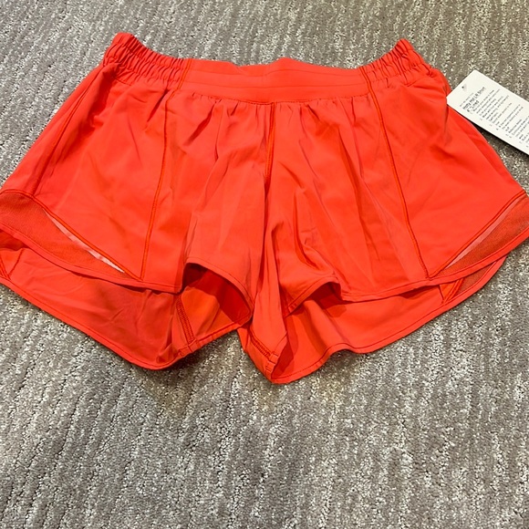 lululemon athletica Pants - NWT Lululemon hotty hot low rise short. 4 inch lined. Orange. Size 8.